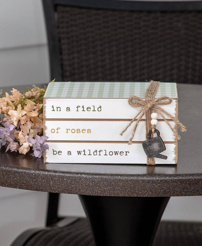In a Field of Roses Be a Wildflower Wooden Book Stack