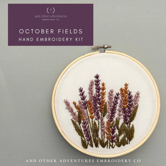 A hand embroidery kit shown with a finished embroidered floral design in a hoop, plus a purple title card reading 'October Fields Hand Embroidery Kit' and branding for And Other Adventures Embroidery Co.