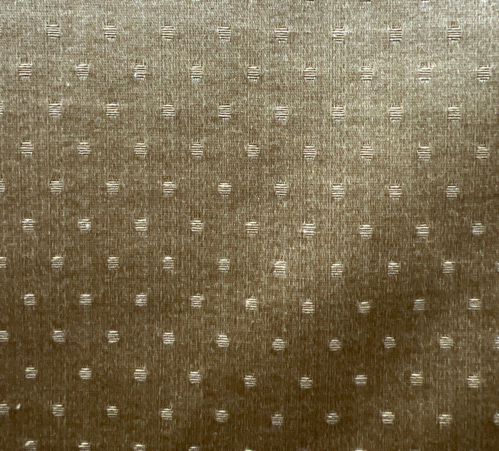 A fabric with a solid pattern, showing slight texture, predominantly beige or light brown in color.